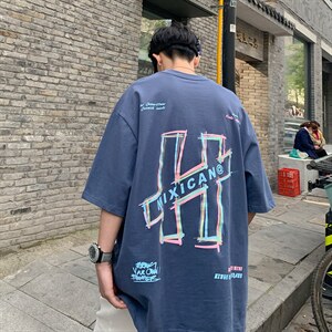 21夏款情侣风240克双纱棉高品质宽松大码圆领卡通印花T恤 T59-P40图片