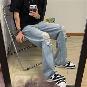 新款男女高街破洞宽直筒个性潮牌牛仔裤长裤子NZ689 批45 控68图片