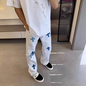 破洞牛仔裤男街头痞帅嘻哈高街十字架贴皮复古白色长裤子NZ8067图片
