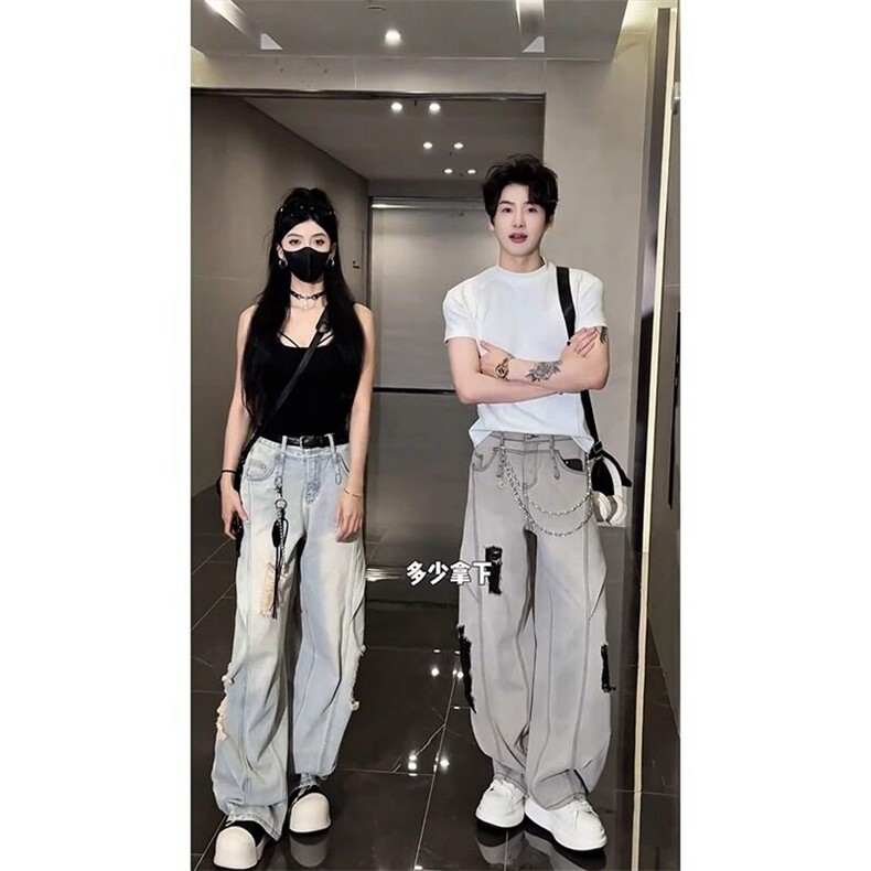 蓝色水洗破洞弯刀牛仔裤男款夏季潮流美式高街痞帅宽松直筒阔腿裤图片