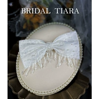 Белая заколка для волос с кисточками с бантиком