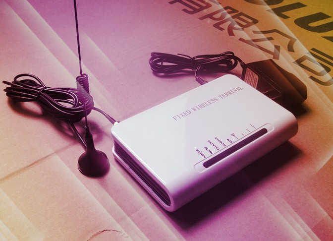 Four - frequency GSM wireless fixed station GSM mobile phone card to fixed phone line conversion platform 5-12V universal