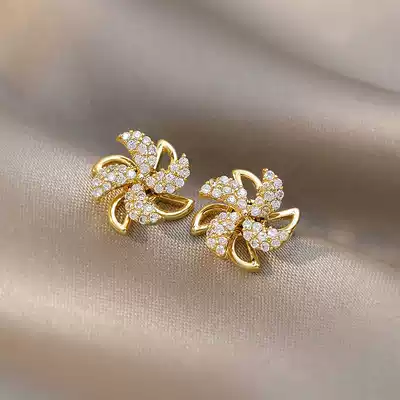 Korean windmill ear needle rotating female summer small high-level sense Sterling Silver small design sense 2021 New Tide earrings