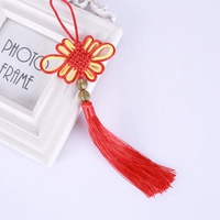 Красные и желтые двойные золотые бусины с узлами.