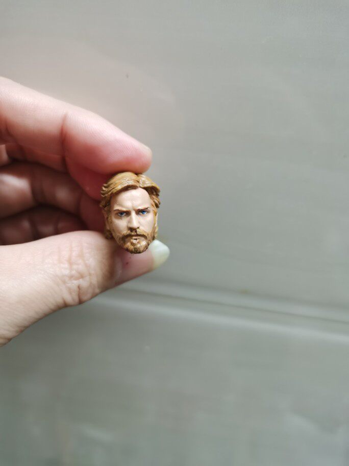1 12 Obi Wan heads with long hair and a doll is not real