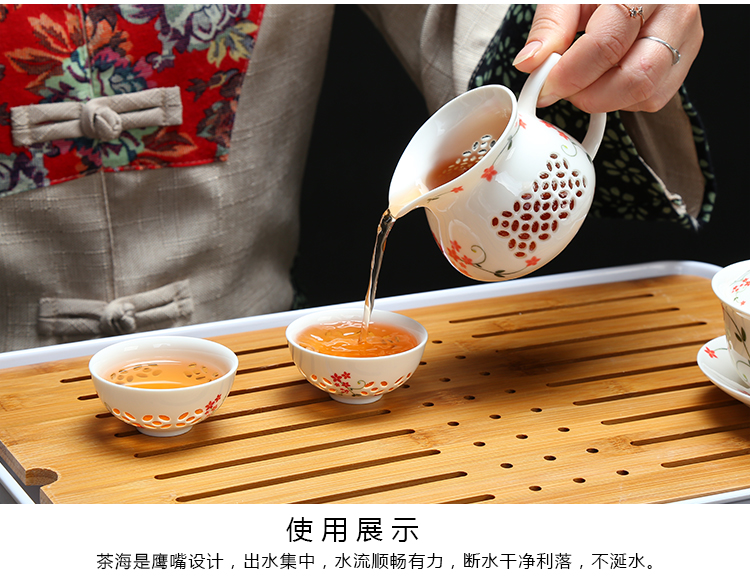 Fujian macros and exquisite tea sets of cellular kung fu tea cups of a complete set of ceramic household hollow out lid bowl and exquisite tea set