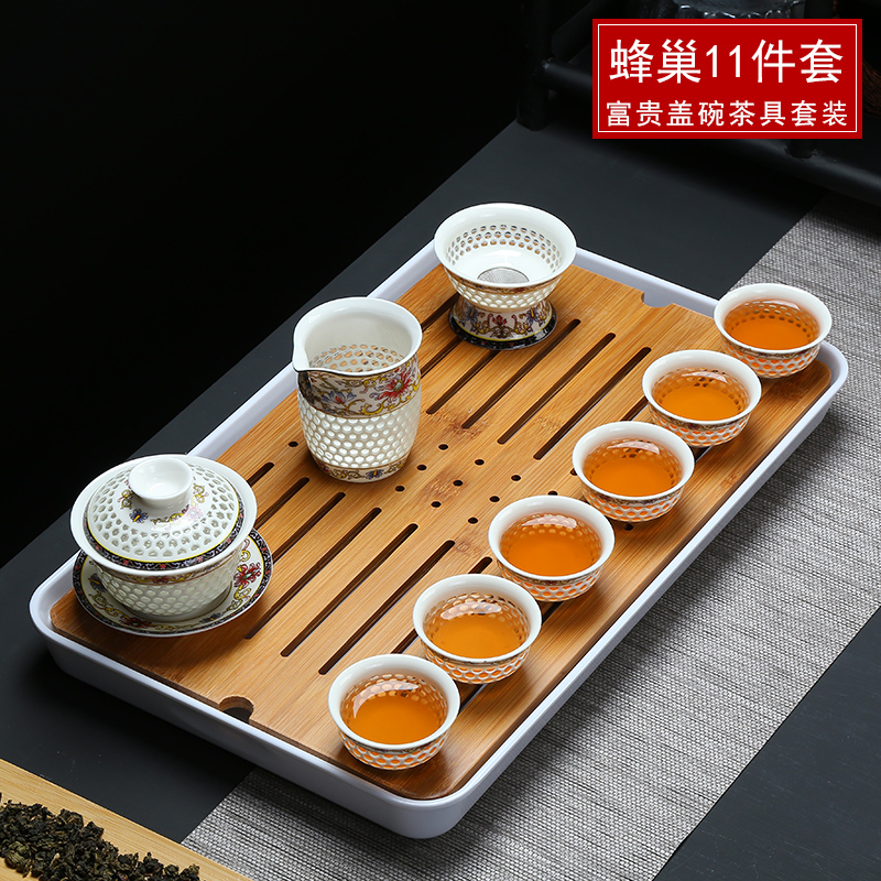 Exquisite blue and white porcelain tea set kit cellular hollow ceramic kung fu tea tea tray was set the set of coasters teapot teacup