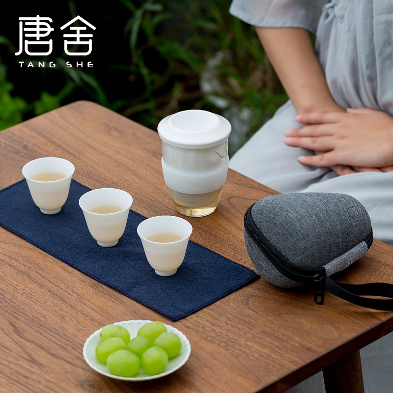 Don difference up suet jade porcelain crack cup against a pot of three cups of hot ceramics glass portable travel kung fu tea set