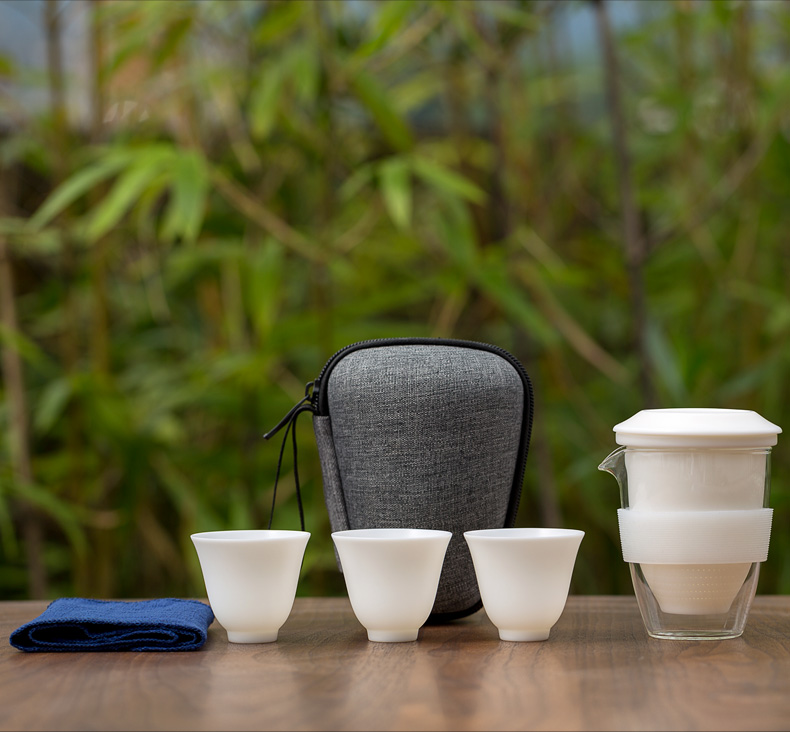 Don difference up suet jade porcelain crack cup against a pot of three cups of hot ceramics glass portable travel kung fu tea set