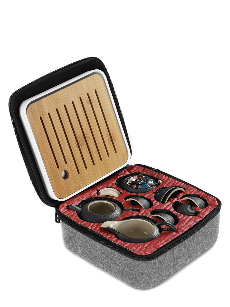Black pottery travel kung fu tea set to crack a pot of four cups of small portable bag outside Japanese mini household contracted