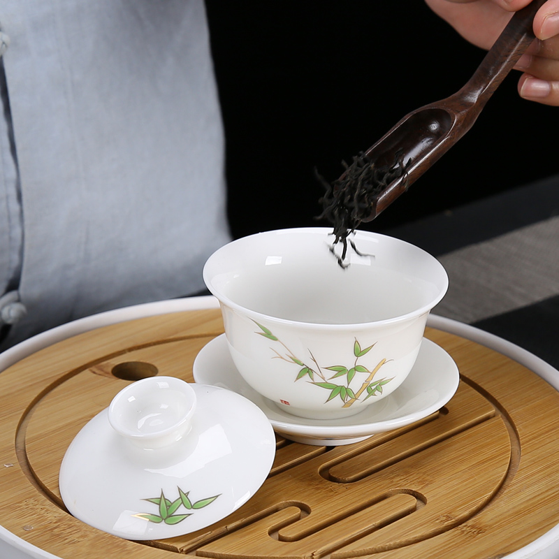 Dehua white porcelain kung fu tea set suit household suet jade cups of a complete set of the tea pot lid to use simple wooden side