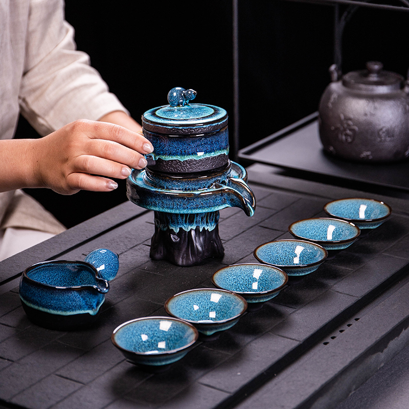 Ya xin $# up tea set home lazy semi - automatic creative stone mill kung fu tea, building ceramic lamp