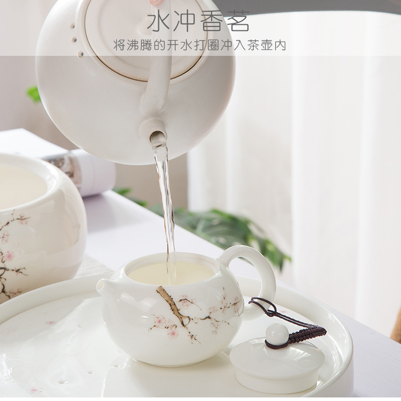 A complete set of dehua white porcelain suet jade suit household green kung fu tea set ceramic tea tray was contracted tea table