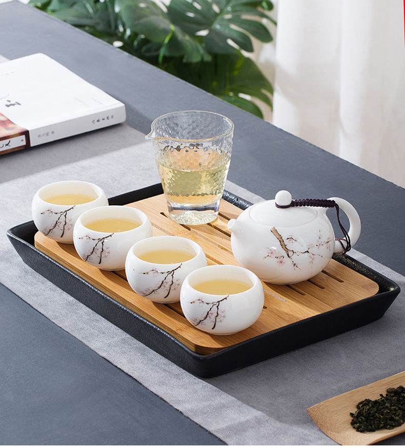 Dehua suet jade white porcelain kung fu tea set suit household contracted is suing portable travel tea pot of ceramic tea tray