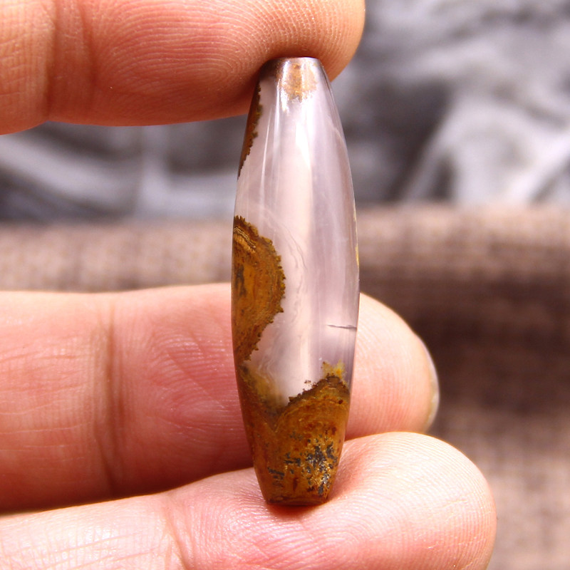 九眼页岩石钱币石中的蒙天珠为何如此珍贵？探寻六股白料一眼小精品的秘密