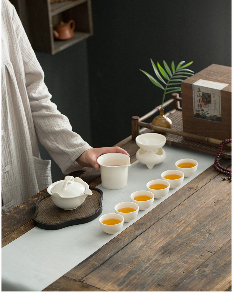 Dehua lard white porcelain hand grasp pot of ceramic kung fu tea tureen filter to use cups with three bowls of household