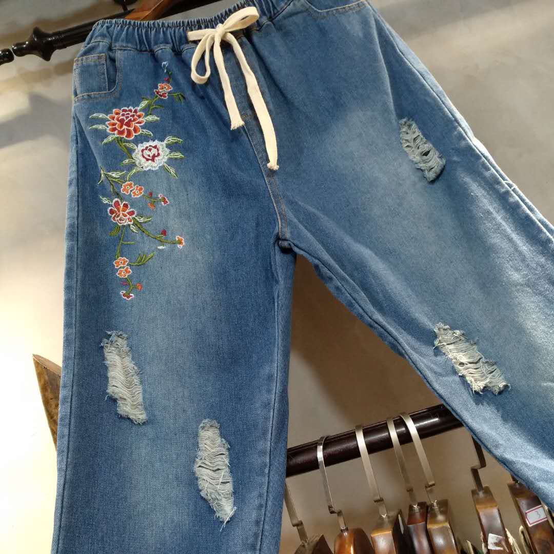 D1 dây thun mới dây rút hoa thêu quốc gia lỗ gió denim quần quần nữ 0,45 quần bò nữ đẹp