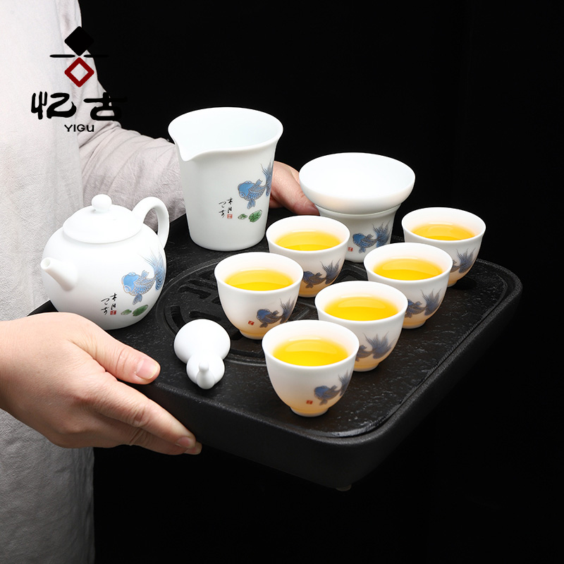 Have the suet jade dehua white porcelain tea set household kung fu tea tea cup lid bowl of a complete set of gift box