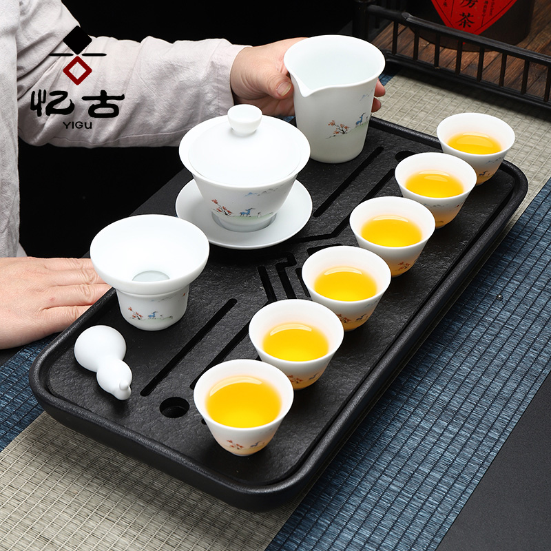 Have the suet jade dehua white porcelain tea set household kung fu tea tea cup lid bowl of a complete set of gift box