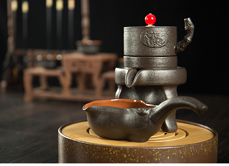 Jane quality household retro black pottery of a complete set of lazy semi - automatic teapot stone mill kung fu tea set ceramic tea set