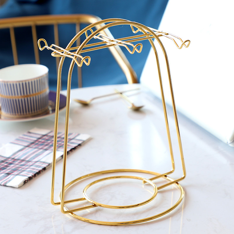 Matching gold shelf for coffee cups and sauces with matching gold