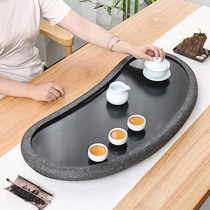 New Chinese whole piece natural black gold stone tea plate Stone head tea table stone tea sea household creative simple round tea plate