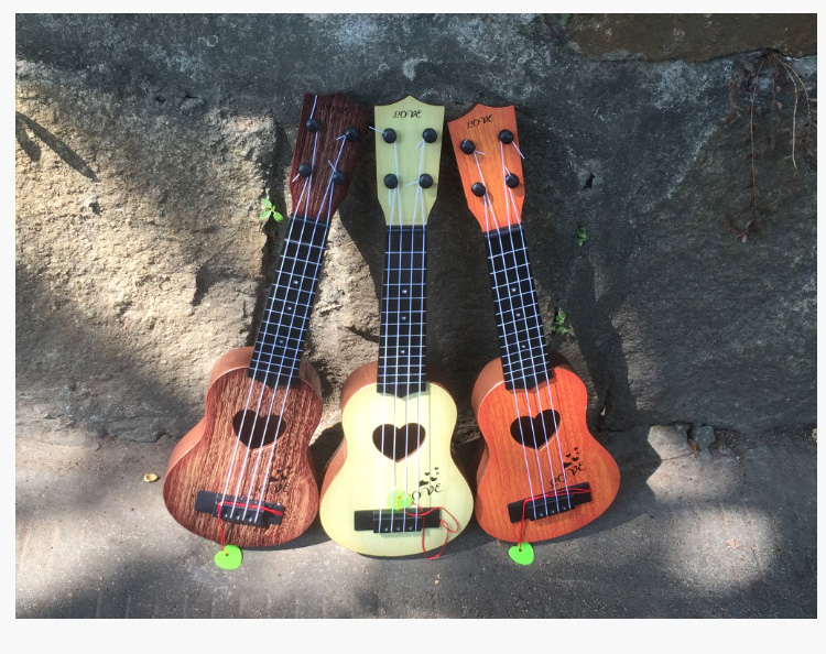 Trẻ em của cây đàn guitar nhỏ, đó là đồ chơi có thể chơi mô phỏng vừa ukulele người mới bắt đầu nhạc cụ âm nhạc để gửi picks