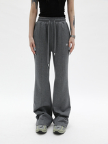 Fuzzykon mid-seam solid color French terry drawstring trumpet sports pants in black and grey