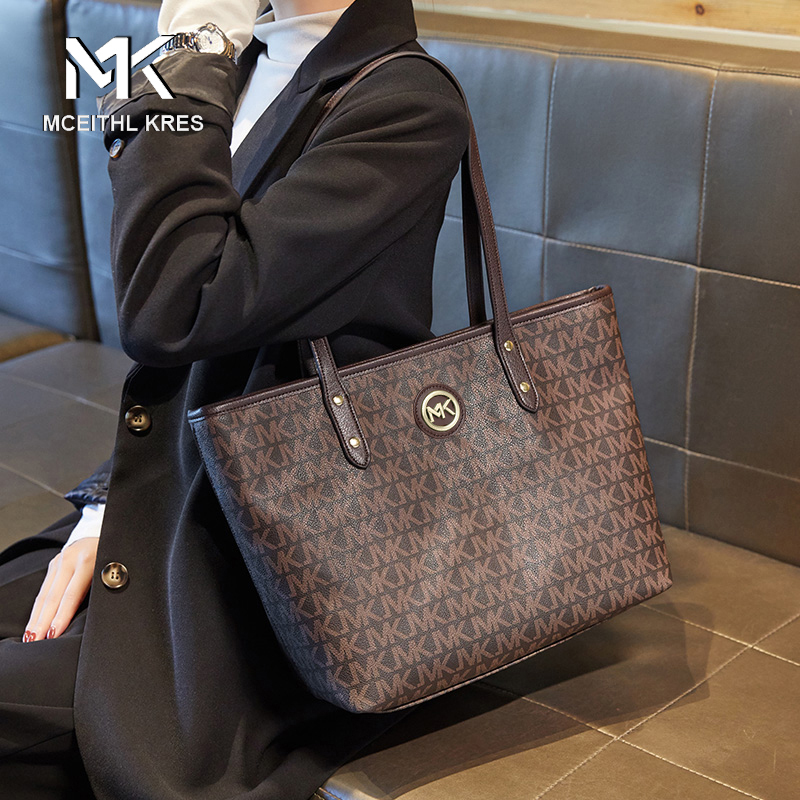 Tot Woman Pack 2022 new tide large capacity old flower pack small class commuter shoulder bag leather bag leather bag