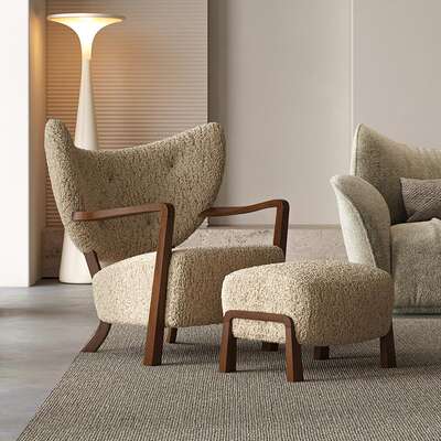 The mid-style designer Woolf lounge chair is a retro solid wood single sofa chair for the living room, balcony and bedroom