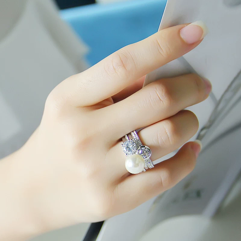 Fashionable ring pearl, accessory, on index finger