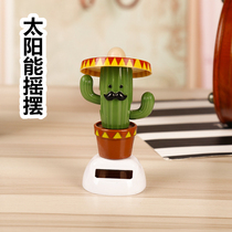Car-borne solar pendulum shaking arm cactus fumbling with the same amount of ecstasy and ecstasy in the interior of the car