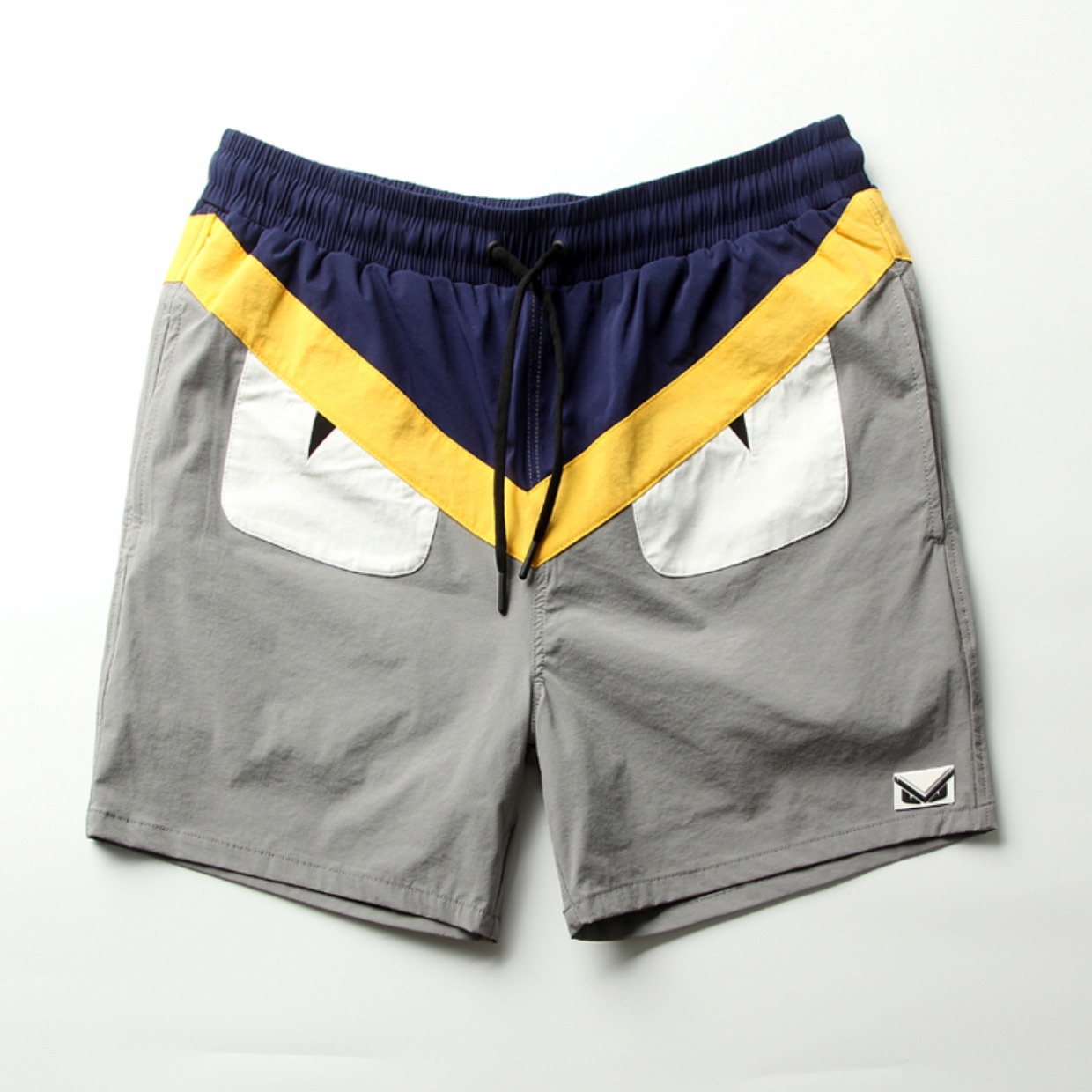 18 quần short mùa hè của quỷ dữ quái vật nhỏ mắt ác ánh sáng và thoáng khí thanh niên nam quần bình thường quần jogger nam