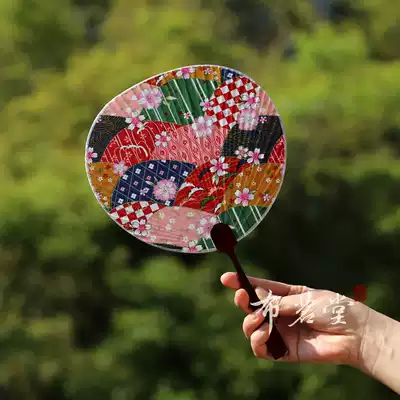 Bu Mingtang wind flower cloth silk group fan Bamboo handle fabric group fan Imported wind fabric