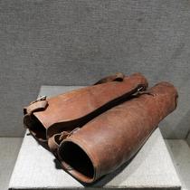 Red collection of old revolutionary objects from the Anti-Japanese War period. Original leather leggings from the small days fidelity suitable for patriotic education.