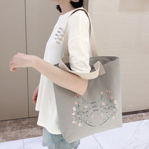 Tote bag female college students class large capacity minority design autumn and winter work shoulder bag New Hand bag Wild