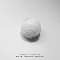 The clockwork House is bored playing a rabbit pompom rabbit tail