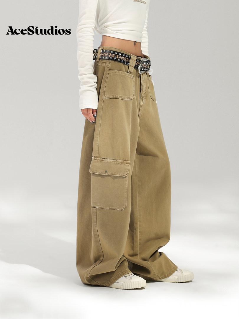Model wearing oversized khaki cargo pants with a white top and sneakers