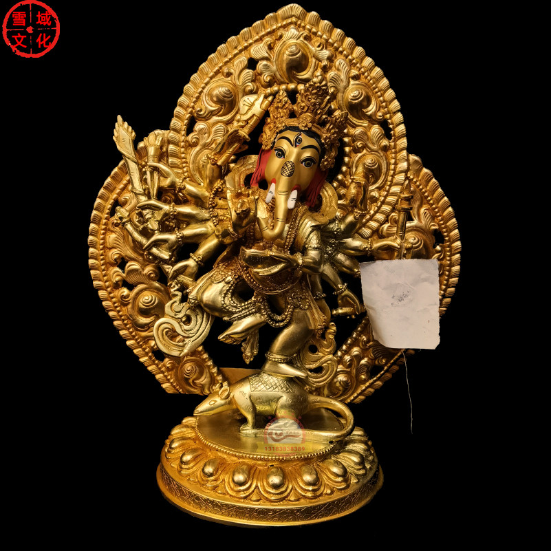 ネパールから輸入された、高さ8インチの金メッキ青銅製の象頭財神像。象の鼻と象の頭を持ち、富と障害の象徴である。