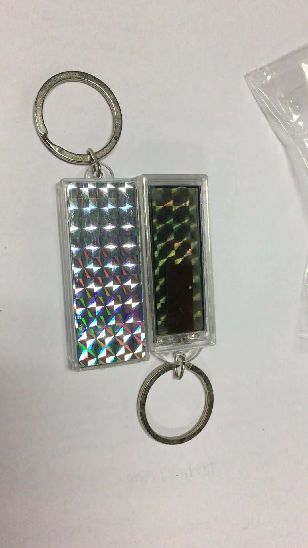 брелок фонарик для ключей. брелок на солнечной батарее. брелок светодиодный. брелок жидкокристаллический на солнечный. светящийся брелок для собак от трикси.