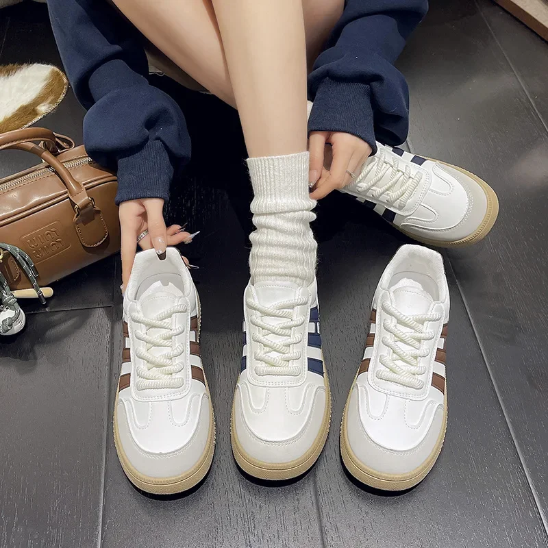 Classic retro white sneakers for leisure with shoelaces flat for…