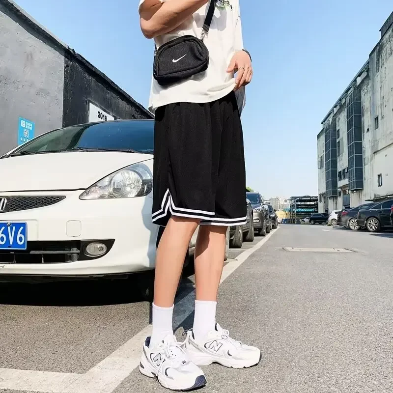 Wholesale manufacturer summer mesh fabric breathable quick-drying men's sports American casual outerwear shorts, suitable for football and trendy styles