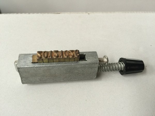 DY-6 for a code-machine aluminum character with a lett grain head