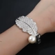 Big Pearl Fashion Tính cách hoang dã Vòng đeo tay lớn Kim loại Châu Âu và Mỹ Vòng đeo tay phóng đại Vòng tay áo len với trang trí đầu tiên Nữ tỳ hưu vàng