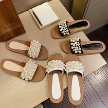  Flat-bottomed slippers womens summer outdoor wear 2021 new first layer cowhide open-toe word drag Roman pearl slippers tide