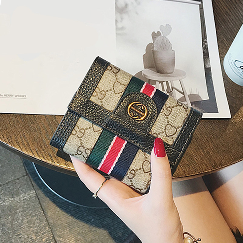 Hong Kong wallet women's summer niche design leather new 2022 hot style short style small hand small bag hand thin style