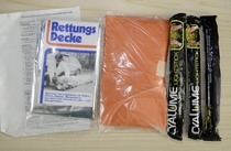 The new 80 s Swiss military version of the mountain soldier first aid kit with warm water bag fluorescent stick survival blanket