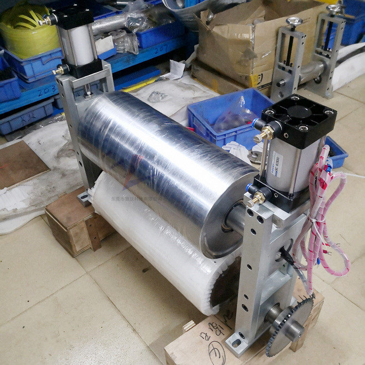 The feeder tractor drum conveying equipment receiving material and discharging coating film actively drives the roller line of the press roller line.