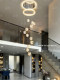 Jingmeng Modern Light Luxury Crystal Chandelier for Duplex Staircases with Multi-Head Ring Design, High-End Feel for Open-Space Living Room Lighting