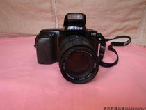 Japanese Nikon F50 automatic camera film machine with Shima 70-210 lens nostalgic object